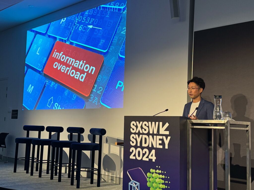 海外カンファレンスで登壇中の田中真二氏